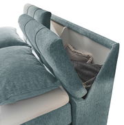 Boxspringbett SET ONE FAIRFIELD von Musterring in seitlicher Perspektive mit Stauraum im Kopfteil, bezogen mit blauem Stoff.