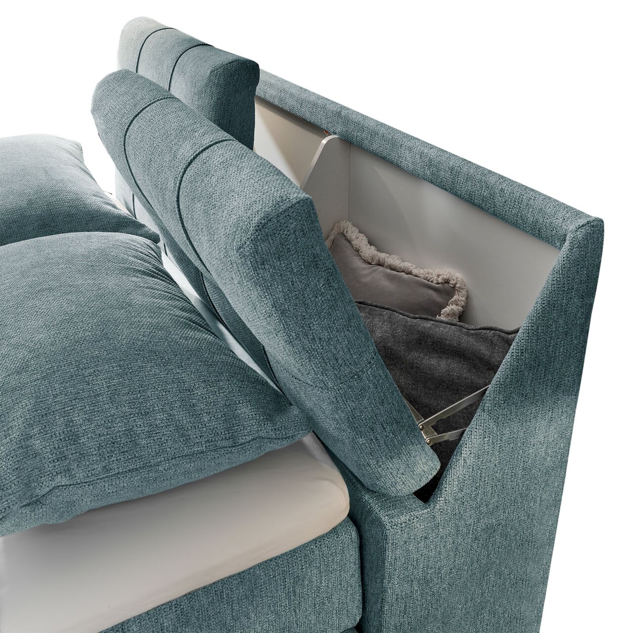 Boxspringbett SET ONE FAIRFIELD von Musterring in seitlicher Perspektive mit Stauraum im Kopfteil, bezogen mit blauem Stoff.