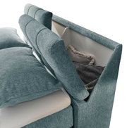 Boxspringbett SET ONE FAIRFIELD von Musterring in seitlicher Perspektive mit Stauraum im Kopfteil, bezogen mit blauem Stoff.
