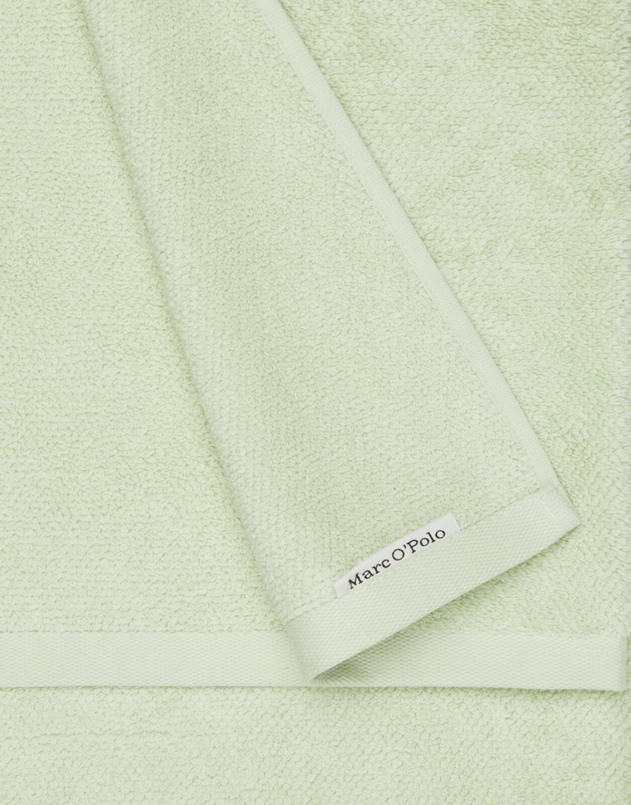 Hellgrünes Handtuch-Set aus weichem Material mit Marc O'Polo-Label, Draufsicht