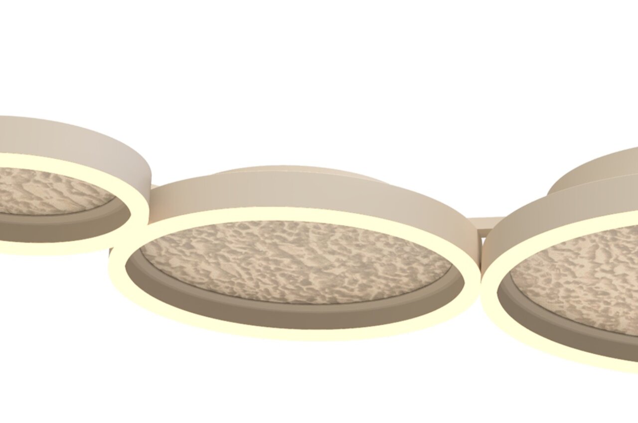 Nahaufnahme einer modernen LED-Deckenleuchte mit runden, leuchtenden Elementen und strukturierter Oberfläche, seitliche Perspektive.