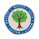 Rundes Emblem mit einem stilisierten Baum in der Mitte, umgeben von einem blauen Ring mit den Worten 'Massiv', 'Solid', 'Massief', 'Masivo'. Frontalansicht.
