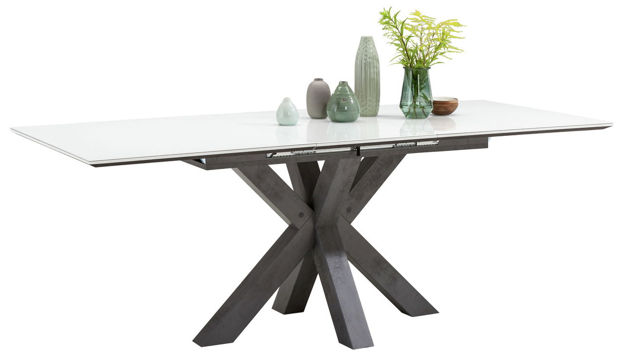 Moderner Esstisch mit weißer Tischplatte und kreuzförmigem, dunklem Gestell, seitliche Perspektive