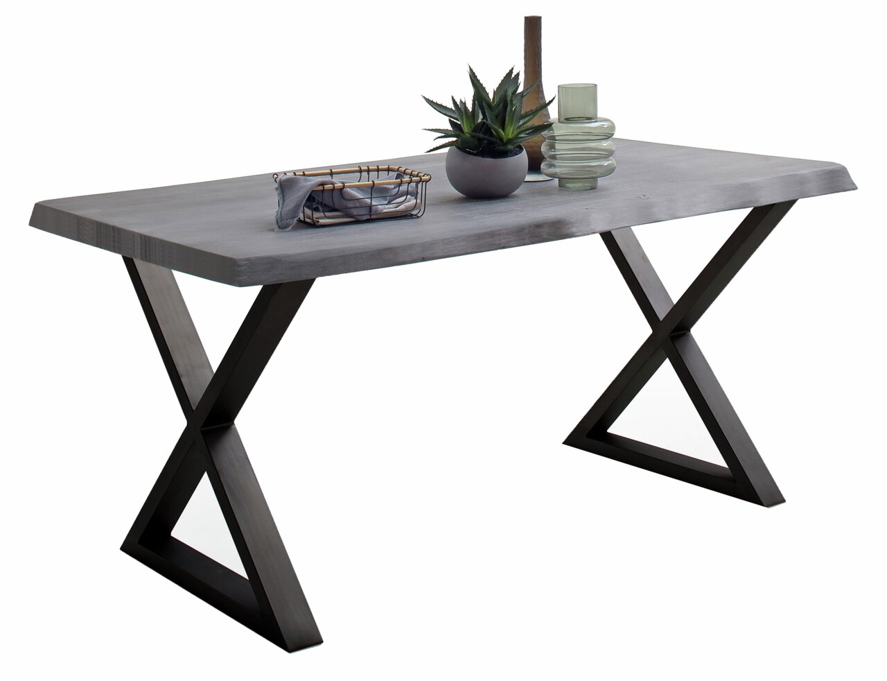 Moderner Esstisch mit X-förmigen Beinen aus dunklem Holz und einer glatten, grauen Tischplatte, seitliche Perspektive