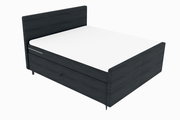 Boxspringbett in dunklem Holzdesign, seitliche Perspektive