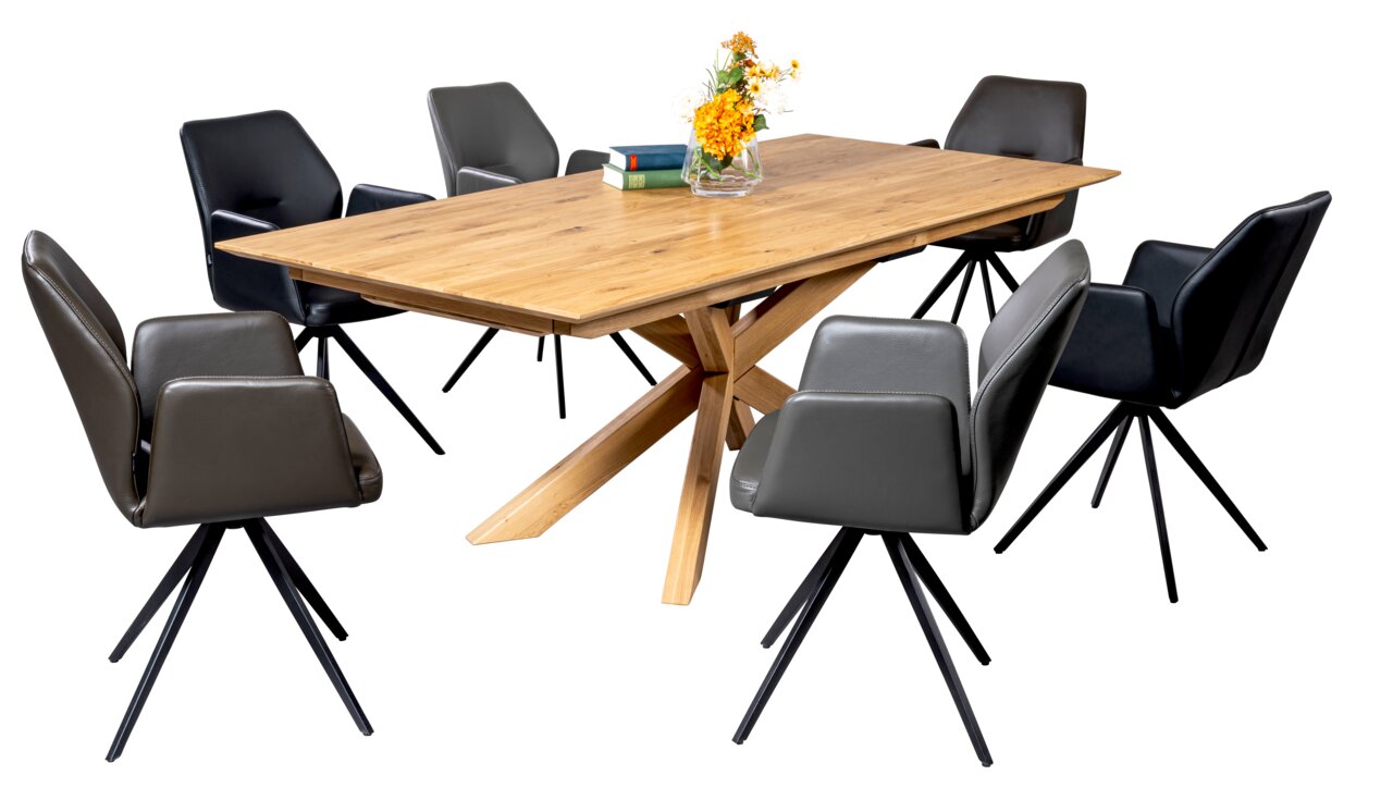 Linea Natura Esstisch FRANK Esstisch aus Holz mit sternförmigem Fuß, umgeben von sechs modernen Stühlen, seitliche Perspektive