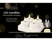 Vier aufladbare LED-Teelichter auf einer Ladestation, mit USB-Kabel, aus der Vogelperspektive.