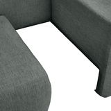 Nahaufnahme einer grauen Recamiere mit strukturiertem Stoffbezug, Blick auf die Ecke der Sitzfläche.