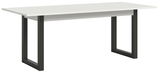 Moderner Esstisch mit weißer Tischplatte und schwarzen Metallbeinen, seitliche Perspektive