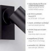 Schwarze moderne Wandlampe RIK aus der SCHÖNER WOHNEN Kollektion mit schwenk- und drehbarem Leuchtenkopf, Nahaufnahme in seitlicher Perspektive (leicht von vorn)