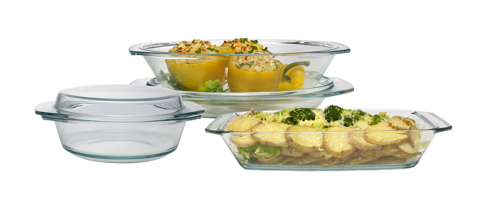 Fünfteiliges Schüsselset aus Glas, gefüllt mit verschiedenen Speisen, aus seitlicher Perspektive fotografiert.