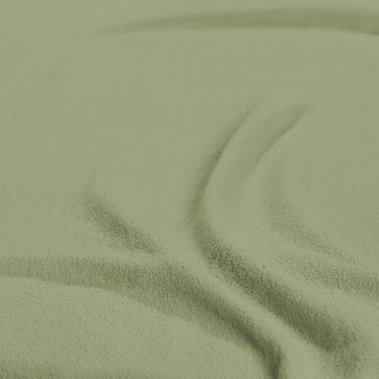 Nahaufnahme eines grünen Spannbetttuchs mit weicher Textur.