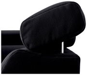 Nahaufnahme einer schwarzen Kopfstütze eines Sofas aus Leder, seitliche Perspektive.