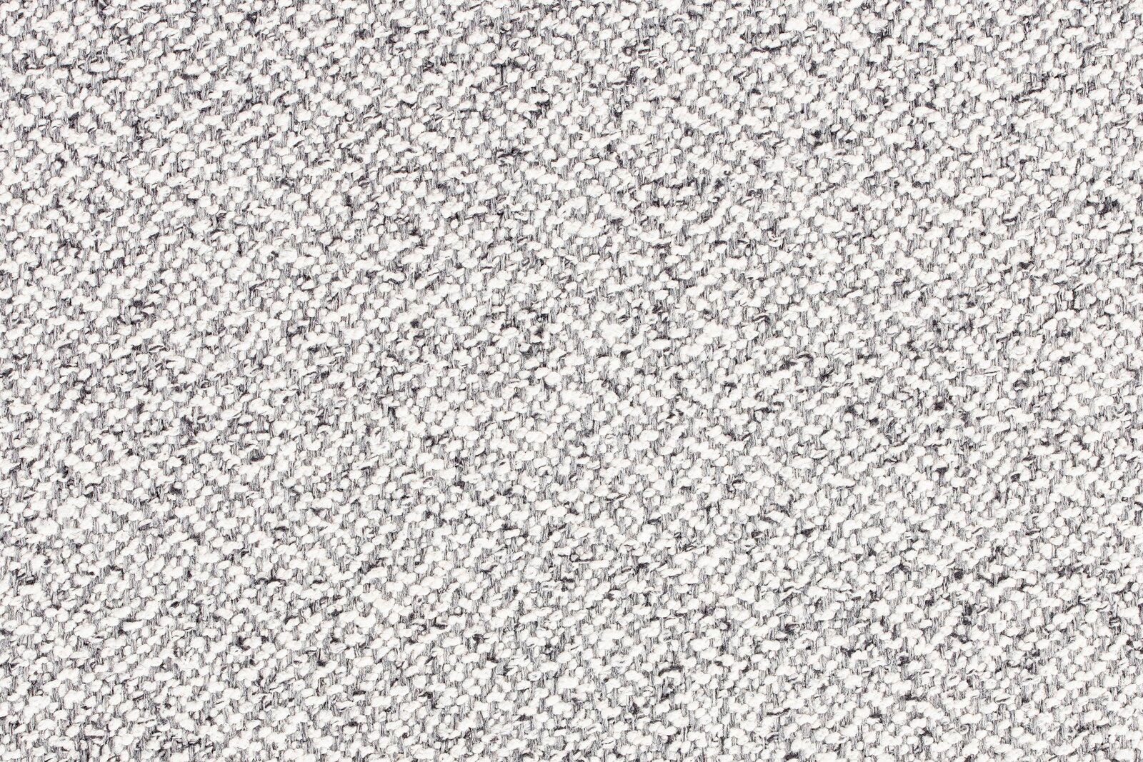 Nahaufnahme einer grauen, strukturierten Stoffoberfläche in Draufsicht