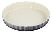 Runde Tarte-Form aus Keramik mit gewelltem Rand, Ansicht von oben.