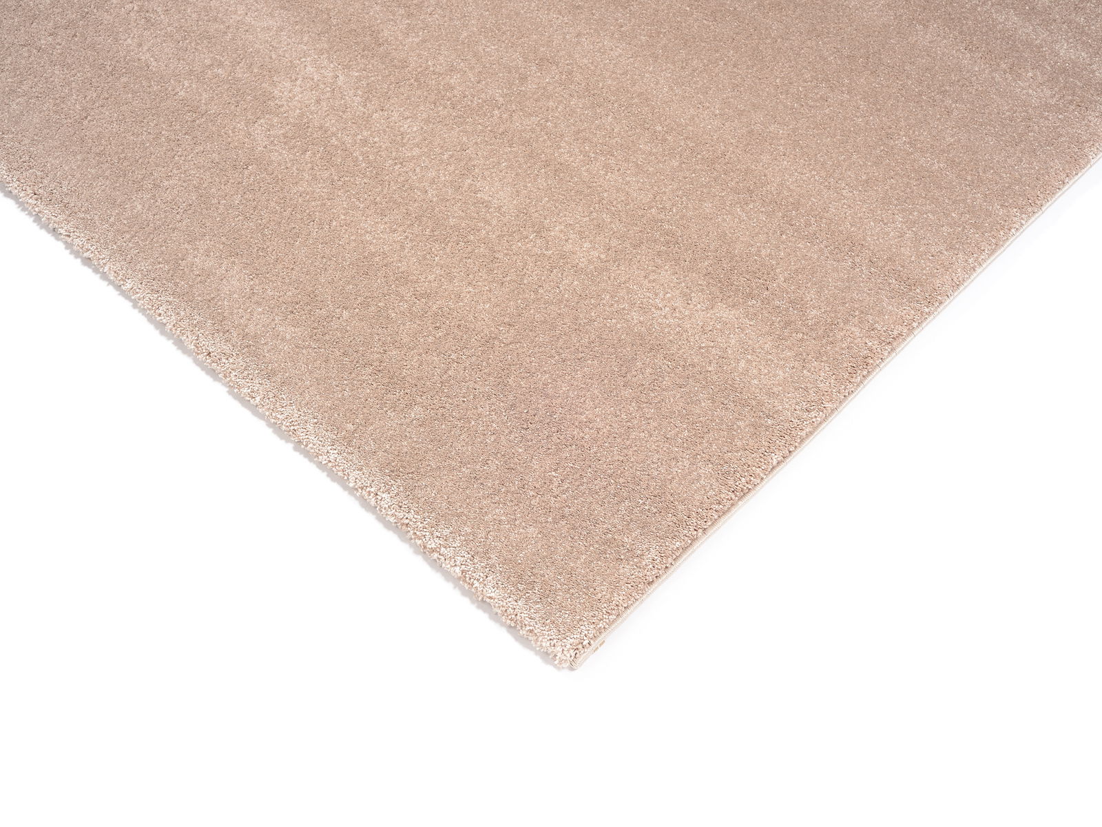 Beige Uni-Teppich in Nahaufnahme, perspektivisch von oben fotografiert