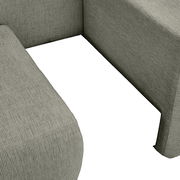 Nahaufnahme einer Recamiere mit strukturiertem Stoffbezug in grauer Farbe, aus der Vogelperspektive aufgenommen.