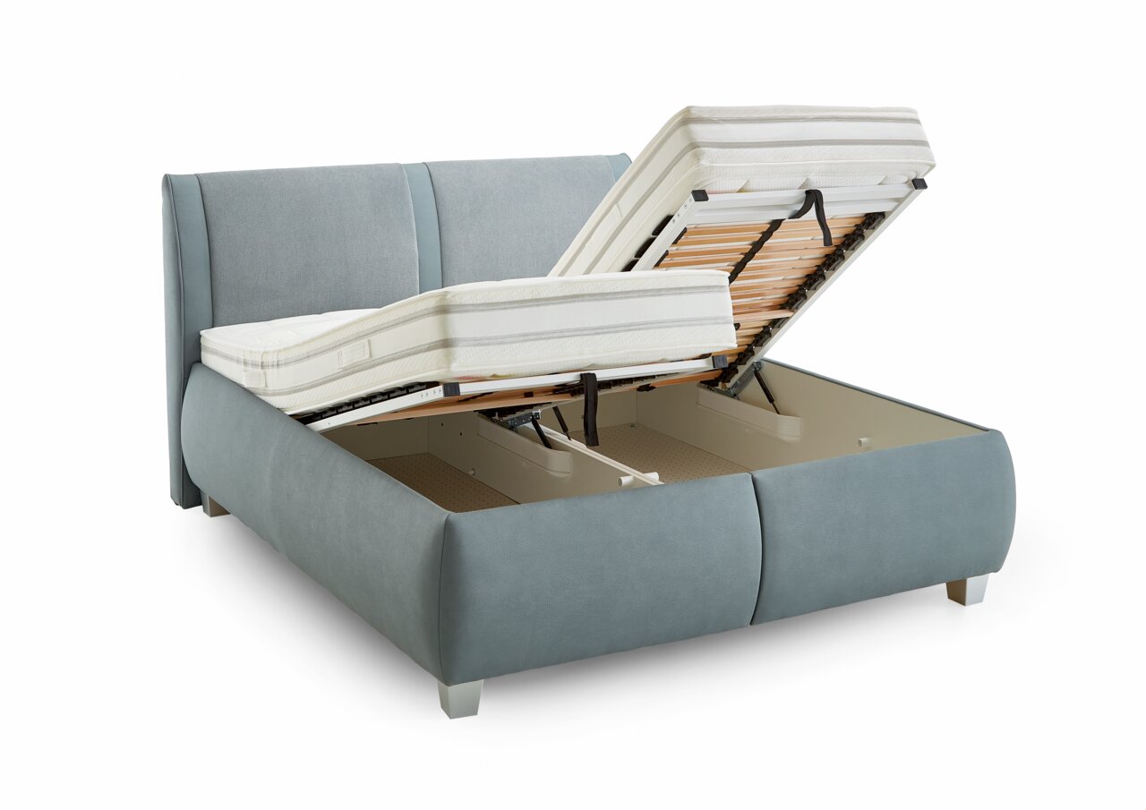 Polsterbett mit hochgeklappter Matratze und Stauraum, seitliche Perspektive