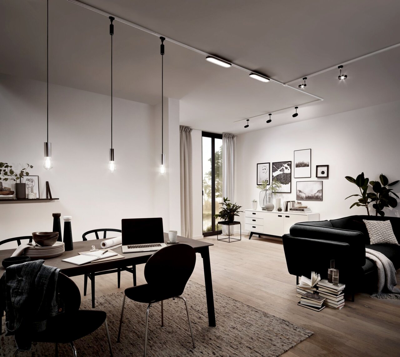 Moderne Pendelleuchten in einem stilvollen Wohnzimmer, aus der Perspektive des Essbereichs betrachtet.