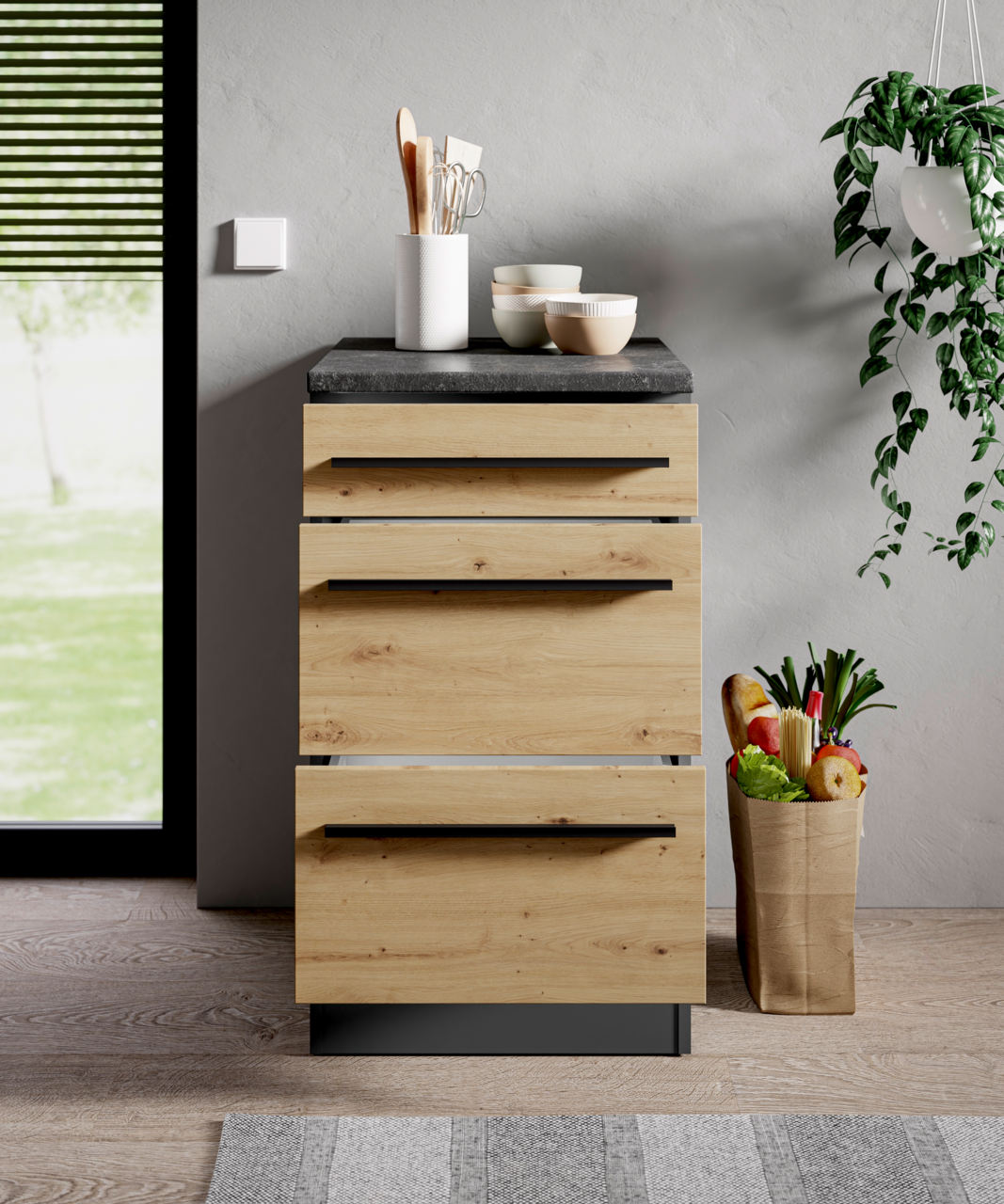 Moderner Unterschrank aus Holz mit drei Schubladen, schwarze Griffe, graue Arbeitsplatte, Frontansicht.