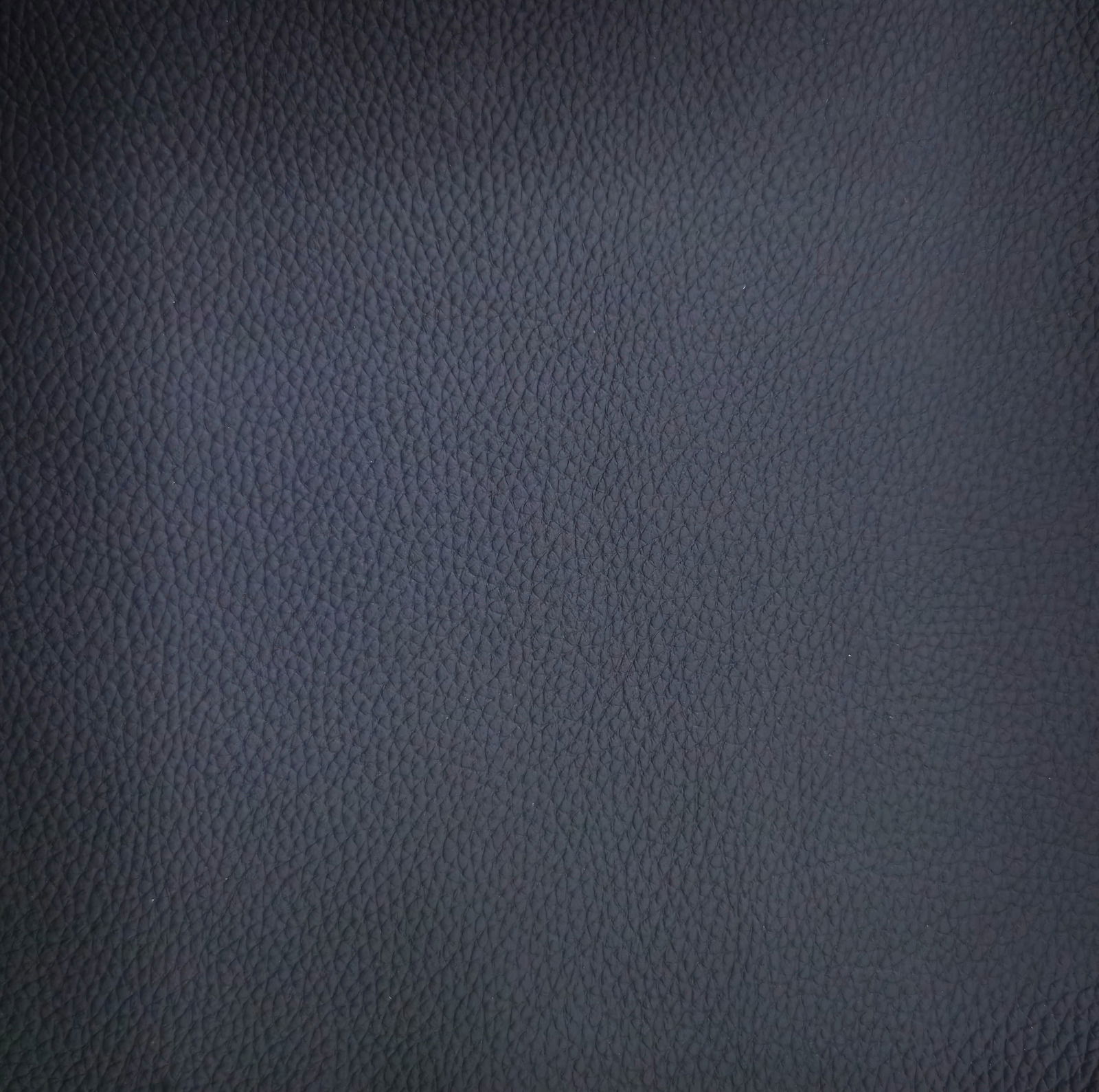 Nahaufnahme der dunkelgrauen, strukturierten Oberfläche des Armlehnstuhls Dieter Knoll Armlehnstuhl PABLO