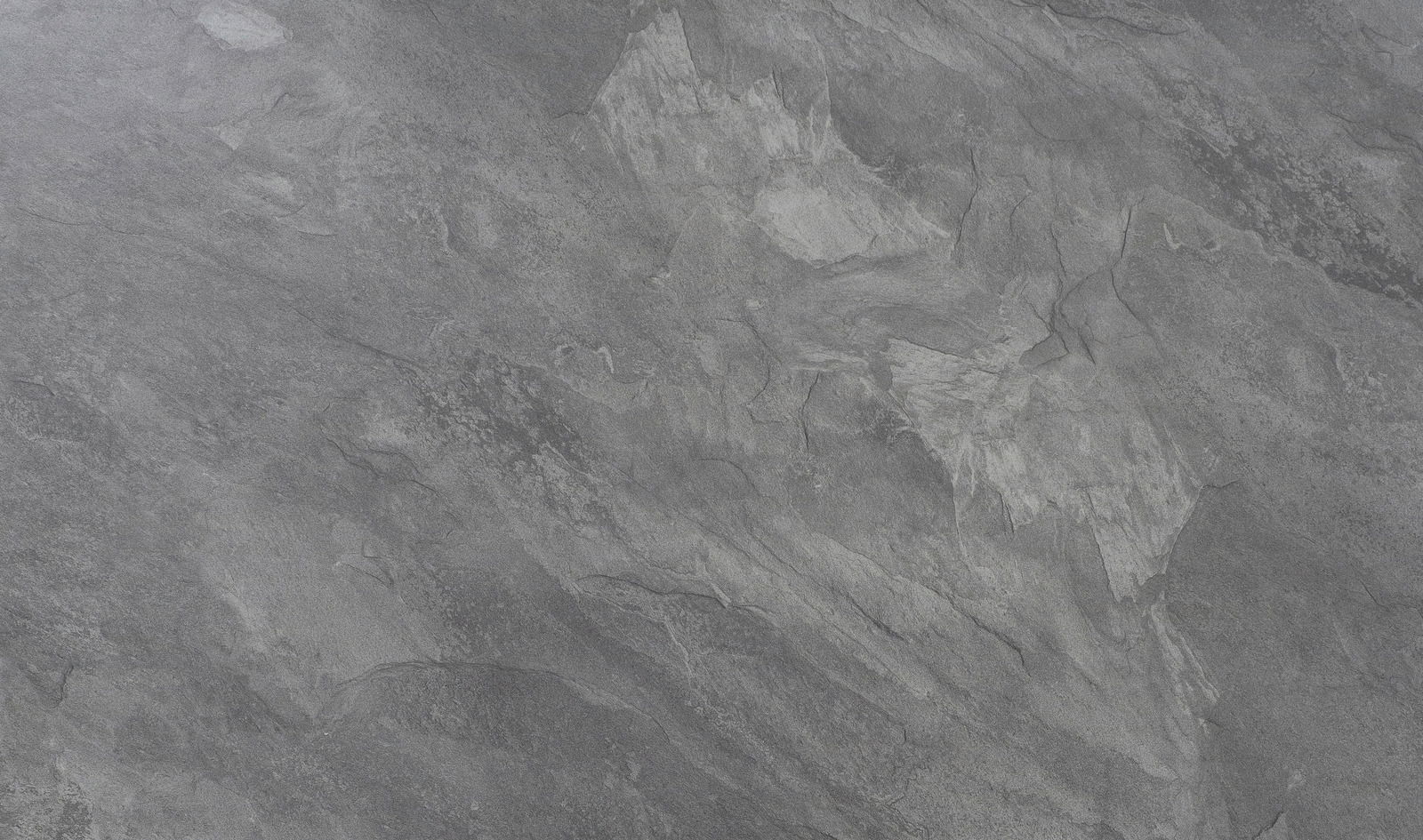 Nahaufnahme einer grauen Steinoberfläche mit natürlicher Textur, Draufsicht