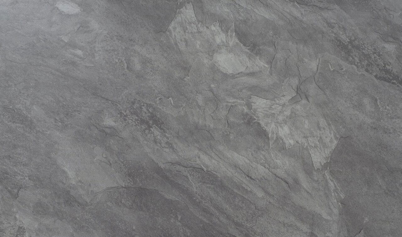 Nahaufnahme einer grauen Steinoberfläche mit natürlicher Textur, Draufsicht