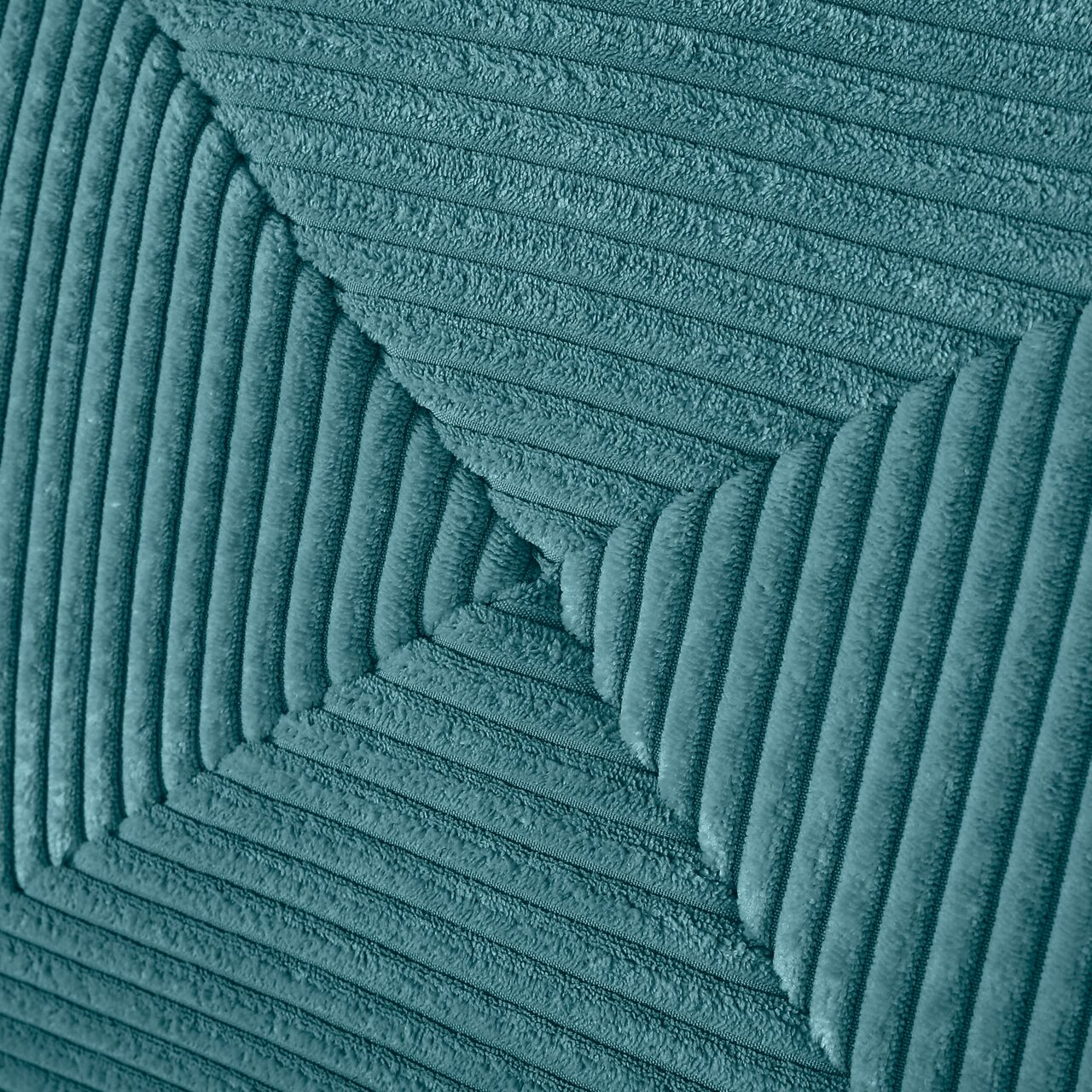 Nahaufnahme eines strukturierten, gerippten Stoffes in Türkis, perspektivisch von oben betrachtet.