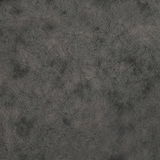 Nahaufnahme einer grauen, strukturierten Oberfläche eines Stuhls