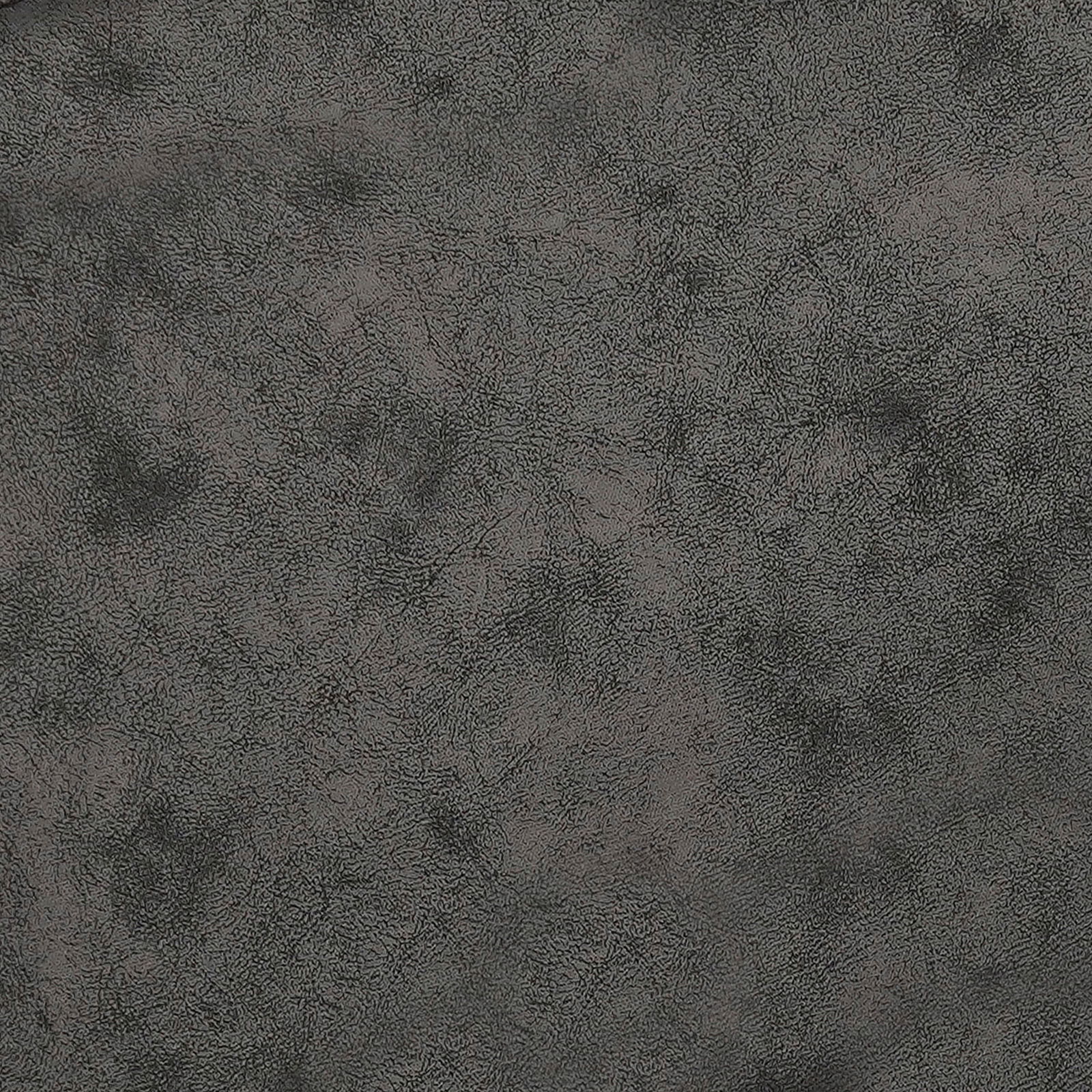 Nahaufnahme einer grauen, strukturierten Oberfläche eines Stuhls