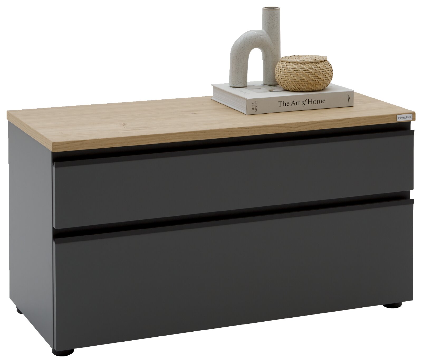 Dieter Knoll Lowboard LENDINA Moderne Kommode mit zwei Schubladen in mattem Anthrazit und heller Holzplatte, dekoriert mit Buch und Vase, schräg von vorne (3/4-Ansicht) fotografiert.