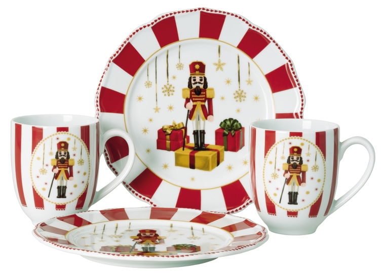 Kaffeeset mit weihnachtlichem Nussknacker-Motiv, bestehend aus zwei Tassen und zwei Tellern, in Rot und Weiß, frontal abgebildet.