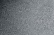 Nahaufnahme einer grauen Stoffoberfläche mit texturierter Struktur