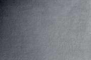 Nahaufnahme einer grauen Stoffoberfläche mit texturierter Struktur