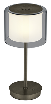 Moderne LED-Tischleuchte KLARA mit zylindrischem, transparentem Schirm und metallischem Standfuß, seitliche Perspektive