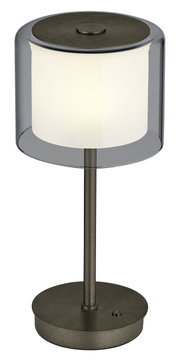 Moderne LED-Tischleuchte KLARA mit zylindrischem, transparentem Schirm und metallischem Standfuß, seitliche Perspektive