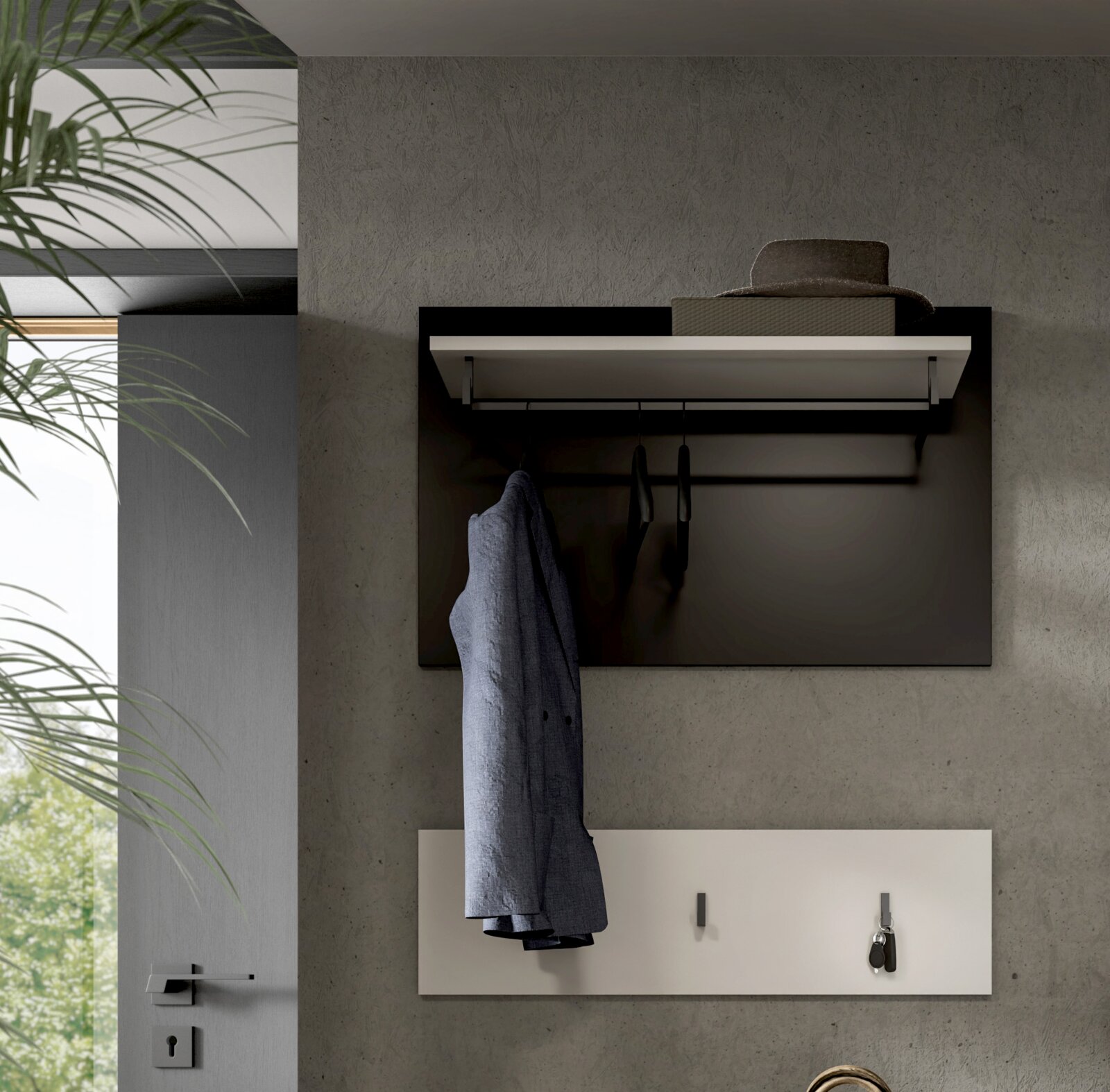 Moderne Wandgarderobe mit Ablageboard und Kleiderstange, schwarzes Paneel mit Bügeln und hängendem Mantel über weißer Schlüsselablage, frontale Ansicht