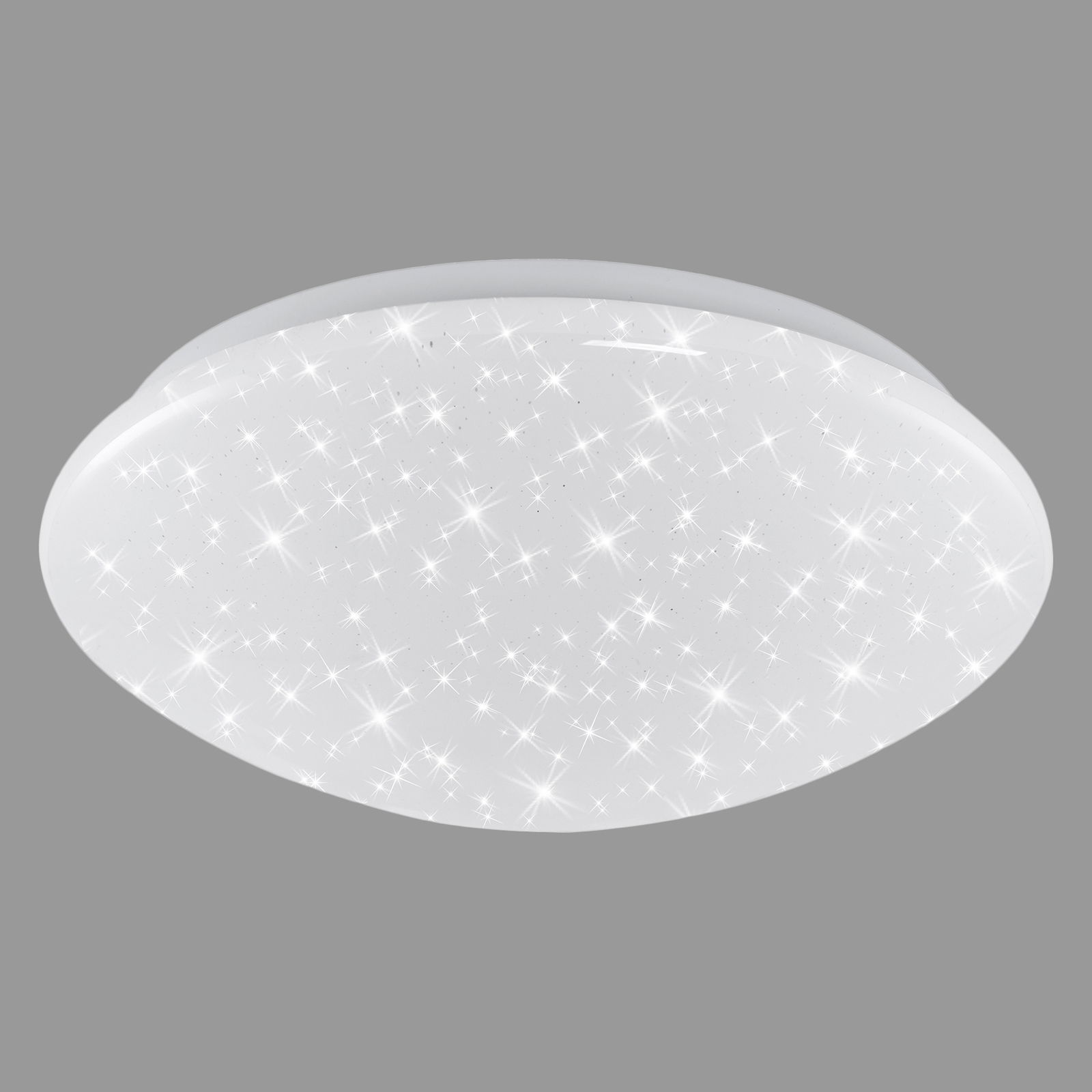 Runde LED-Deckenleuchte aus weißem Kunststoff mit funkelndem Sternenhimmel-Effekt, seitliche Perspektive