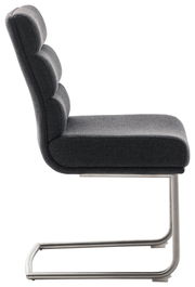 Seitenansicht eines modernen Freischwinger-Stuhls mit grauem Polster und Metallgestell.