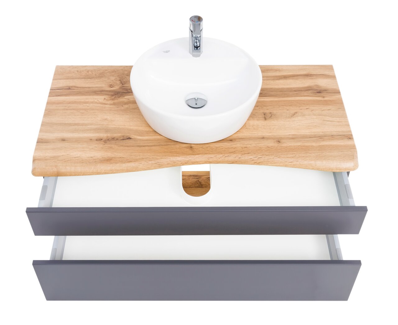Wastafelset met ronde witte wastafel op een houten blad en twee open lades, gezien van bovenaf