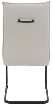 Rückansicht eines Schwingstuhls mit beigem Polster und schwarzem Metallgestell.