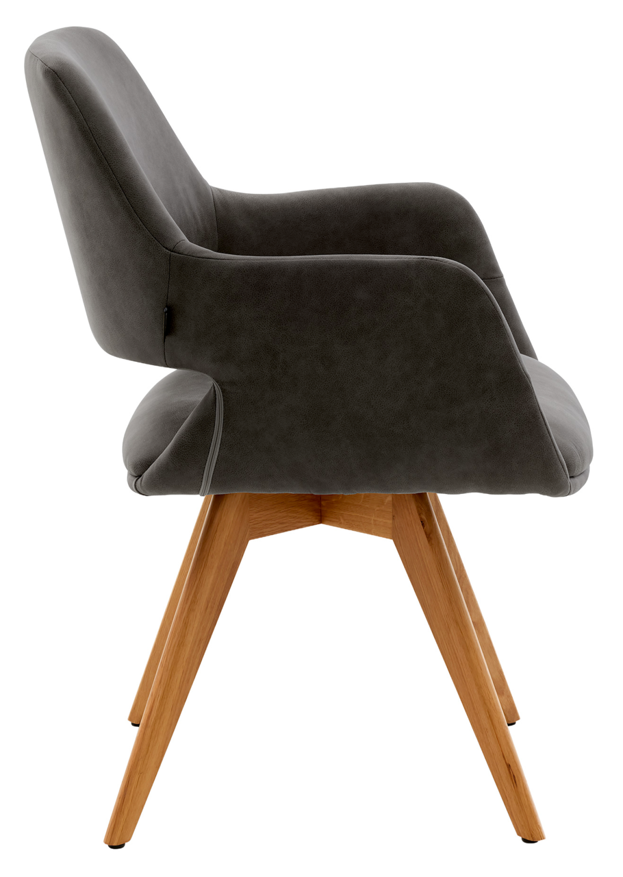 Musterring Fauteuil MR TARIO Seitliche Ansicht eines modernen Armlehnstuhls mit grauem Polster und Holzbeinen.