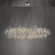Moderner Kronleuchter RICICLE mit funkelnden Kristallen, seitliche Perspektive