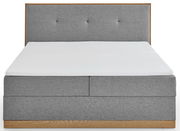 Graues Boxbett mit gepolstertem Kopfteil, Frontalansicht