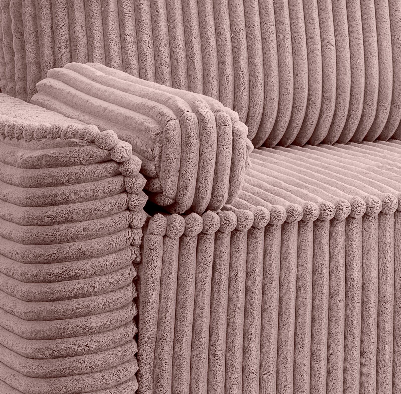 Nahaufnahme eines rosa Schlafsofas mit geripptem Stoffbezug, seitliche Perspektive
