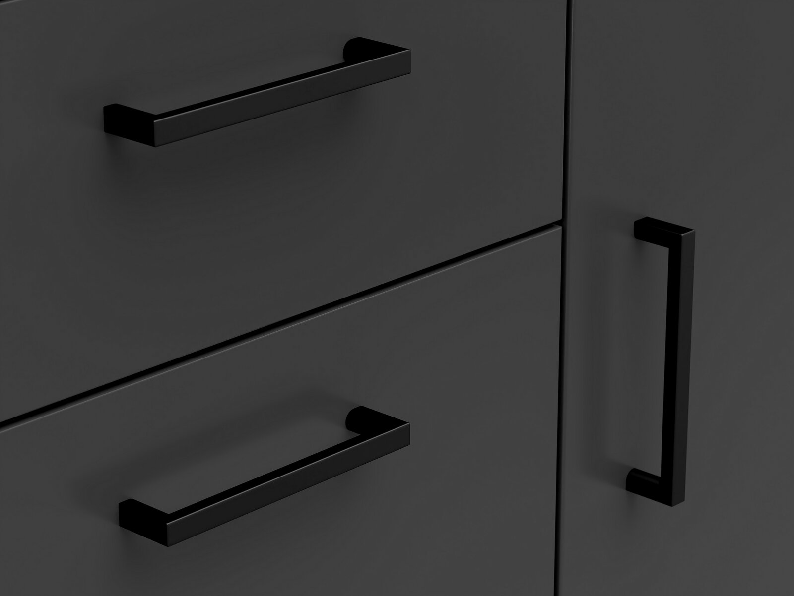 Nahaufnahme einer schwarzen Kommode mit modernen, rechteckigen Griffen aus Metall, seitliche Perspektive