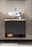 Moderner Waschbeckenunterschrank mit Holzplatte und integriertem Waschbecken, frontal fotografiert.