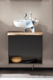 Moderner Waschbeckenunterschrank mit Holzplatte und integriertem Waschbecken, frontal fotografiert.