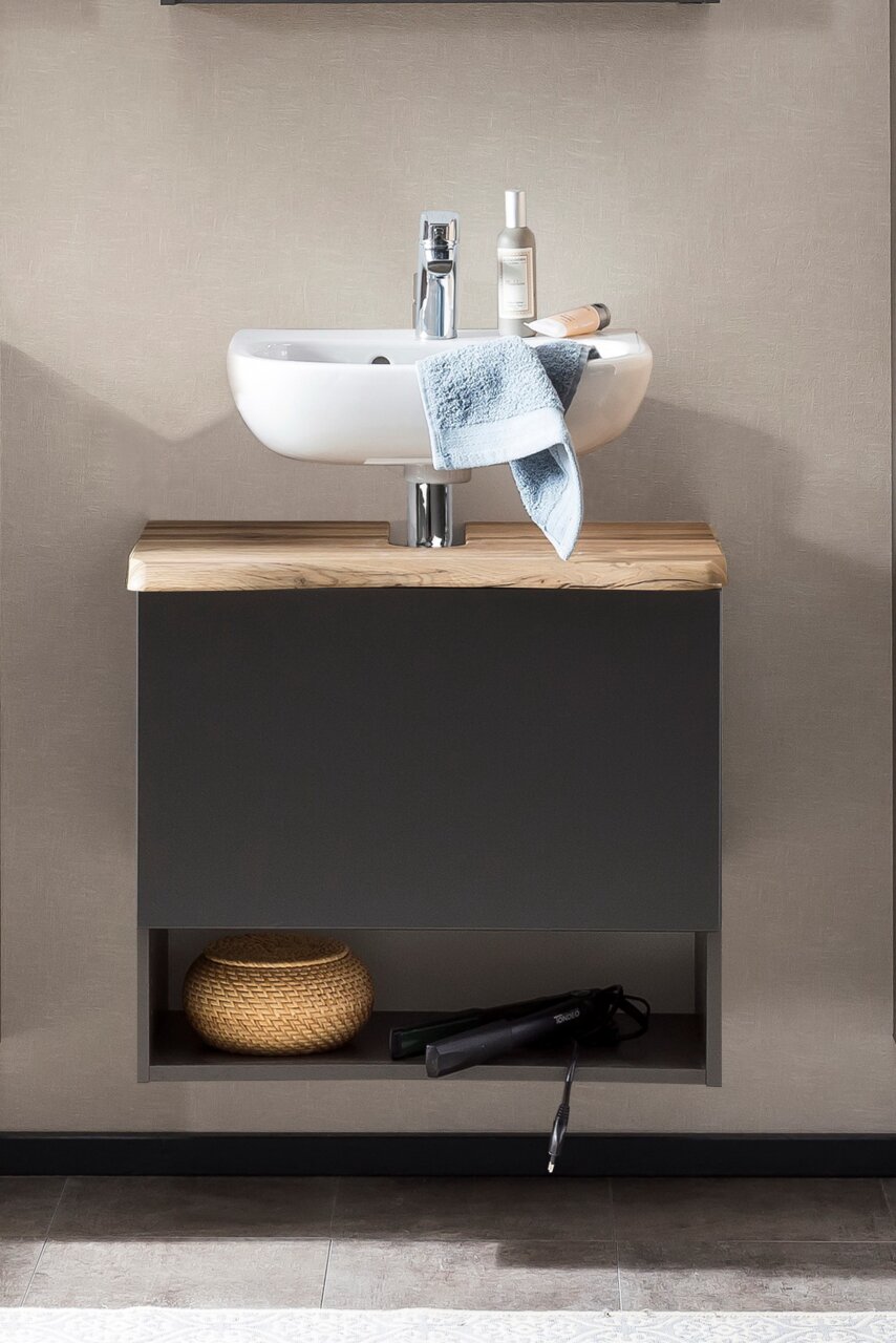 Moderner Waschbeckenunterschrank mit Holzplatte und integriertem Waschbecken, frontal fotografiert.