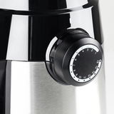 Nahaufnahme einer Kaffeemühle mit einem schwarzen Drehknopf zur Einstellung des Mahlgrades.